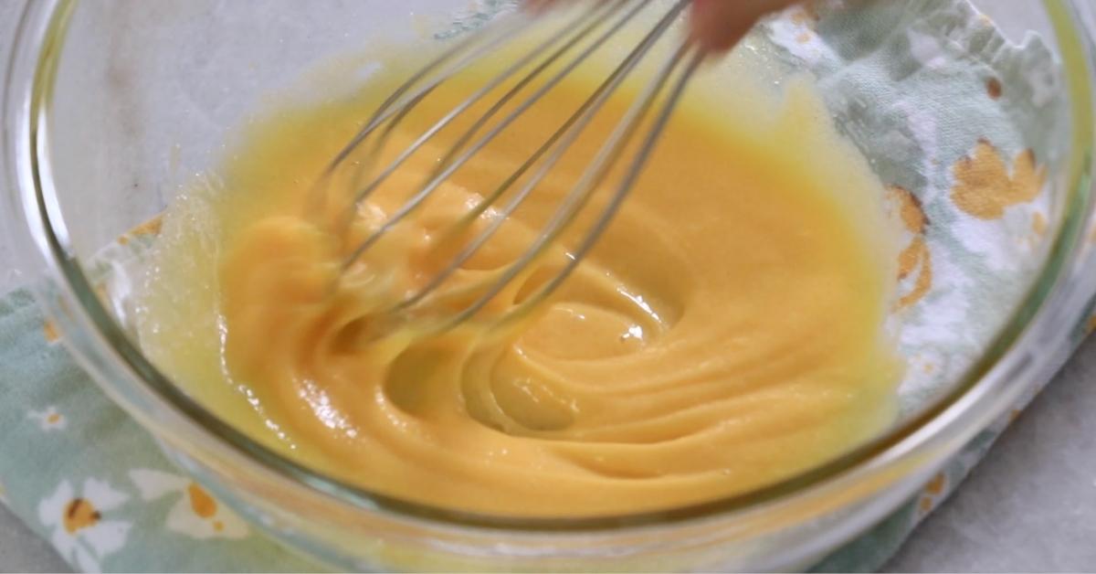 mixing sugar and yolks