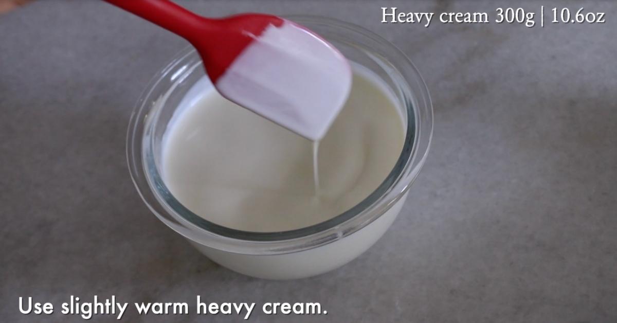 slightly warm heavy cream in a bowl