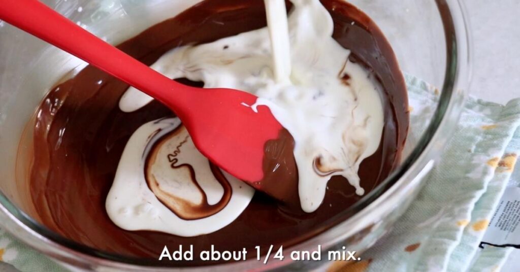 adding heavy cream in melted chocolate