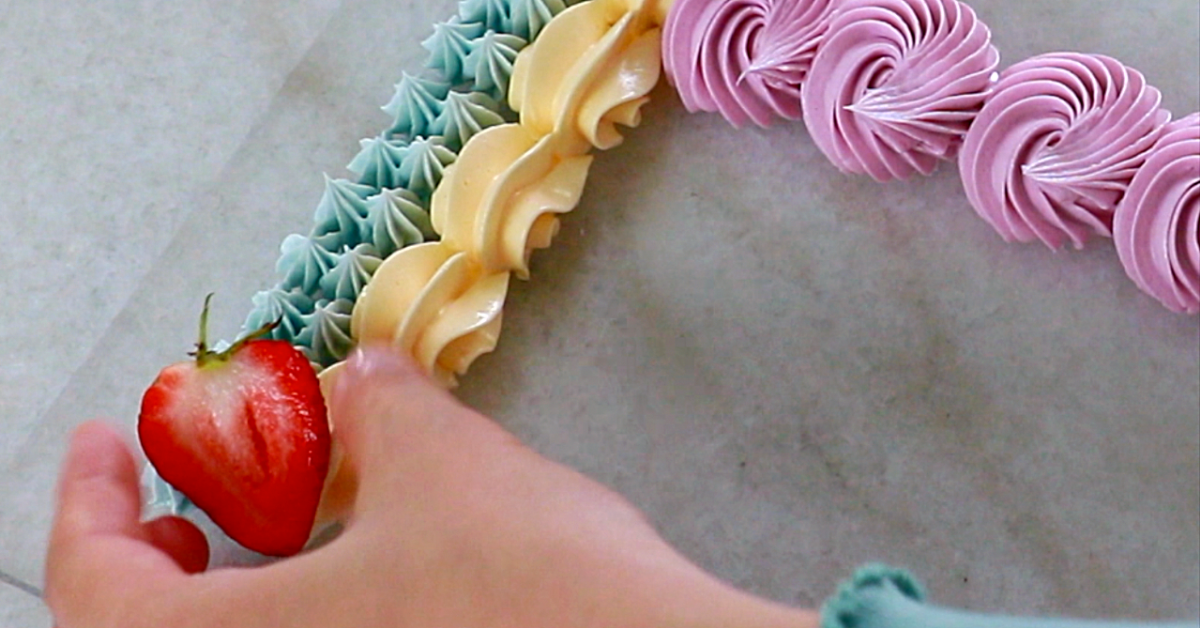 decorating fruits on buttercream piping
