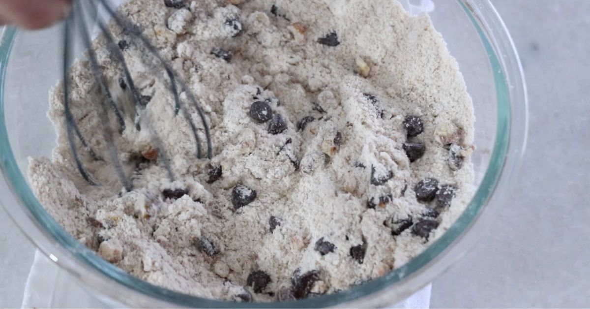 mixing chocolate chips, walnut and flours