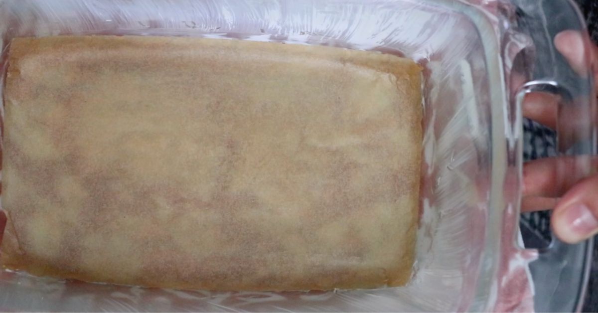 loaf pan coated with butter and a parchment paper on the bottom