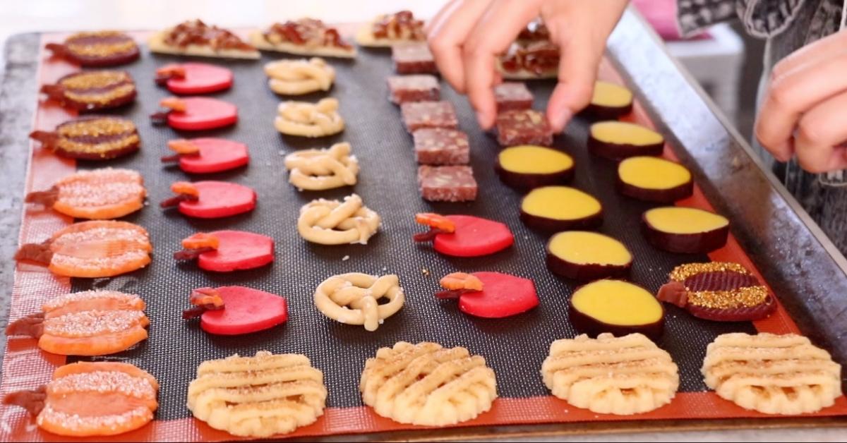 placing fall cookies on a tray