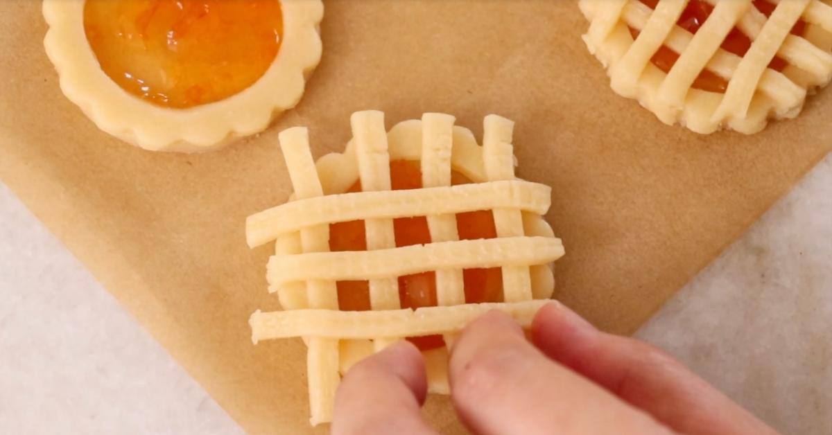assembling cookie dough stripes to make apple pie cookies