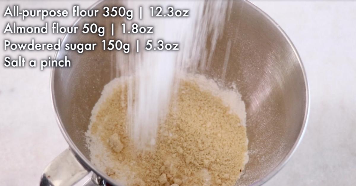 adding flours in a bowl