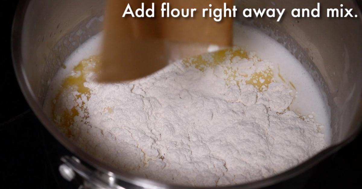 adding flour to the liquids to make pate choux