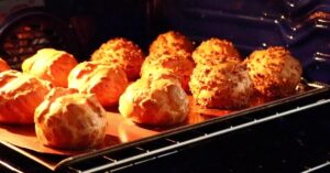 finished cream puffs in the oven