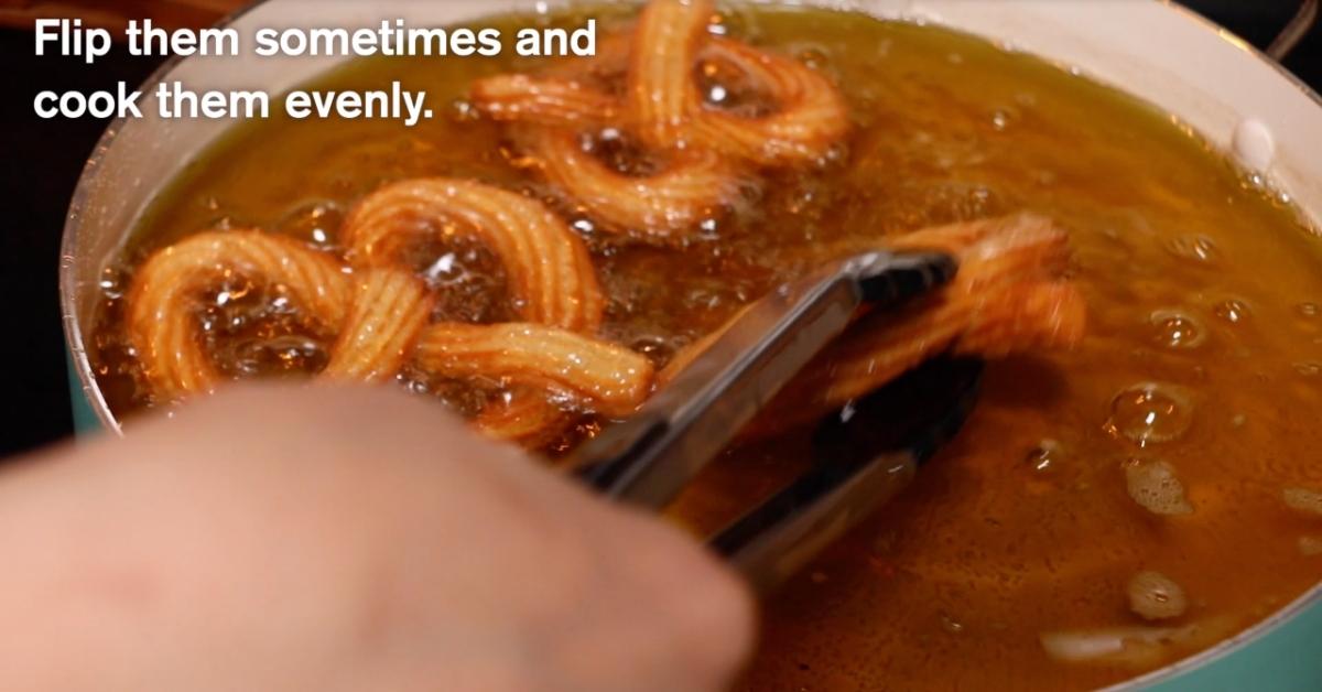 deep-frying churros with pretzel shape