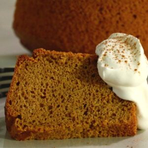 slice of pumpkin spice cake with whipped cream