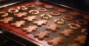 holiday cookies on a tray in the oven