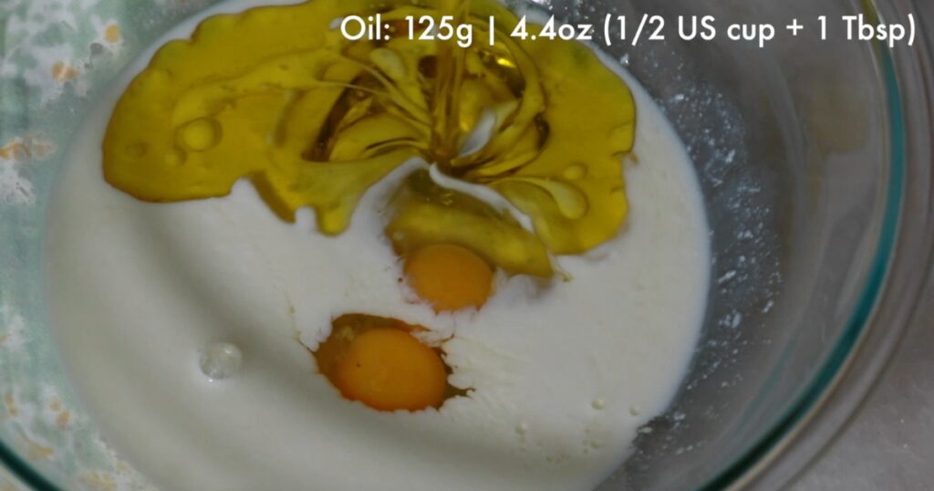 adding oil in buttermilk and eggs