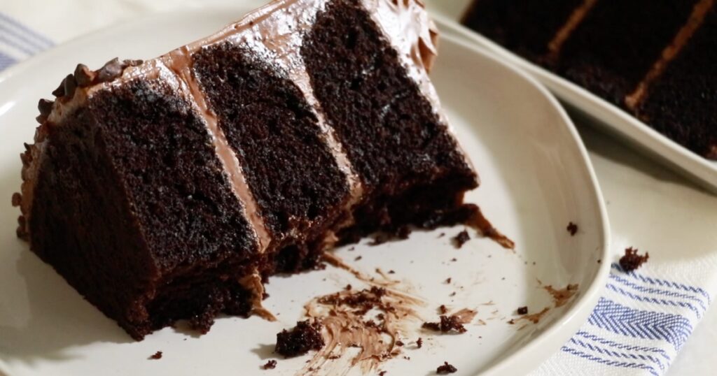 cut chocolate cake with a fork