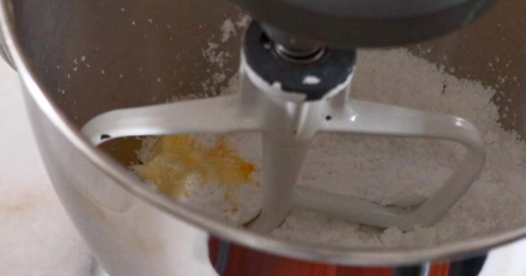 mixing butter and powdered sugar
