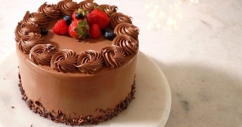 a beautifully frosted chocolate buttercream cake