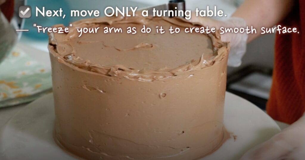 how to move a turning table and arm to frost a cake