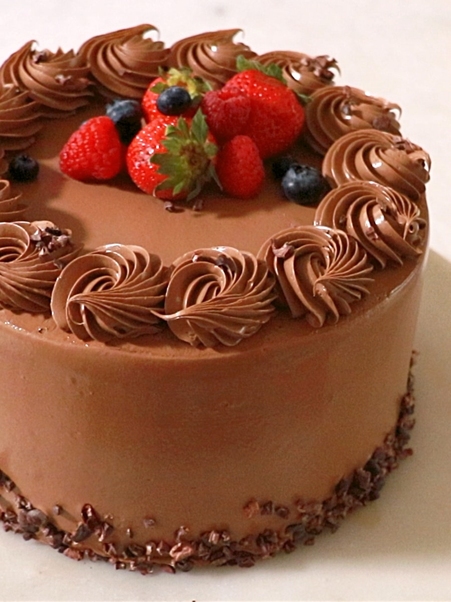 a close up of a 8" chocolate cake with chocolate buttercream