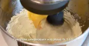 adding eggs in whipped butter and sugar