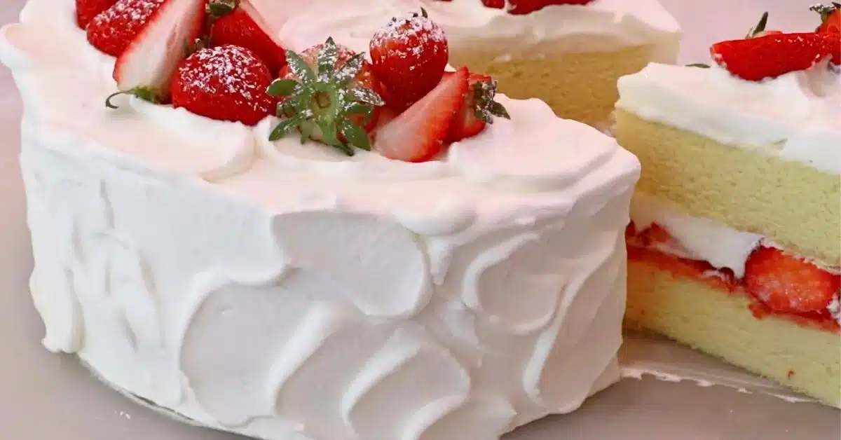 sliced strawberry cream cake