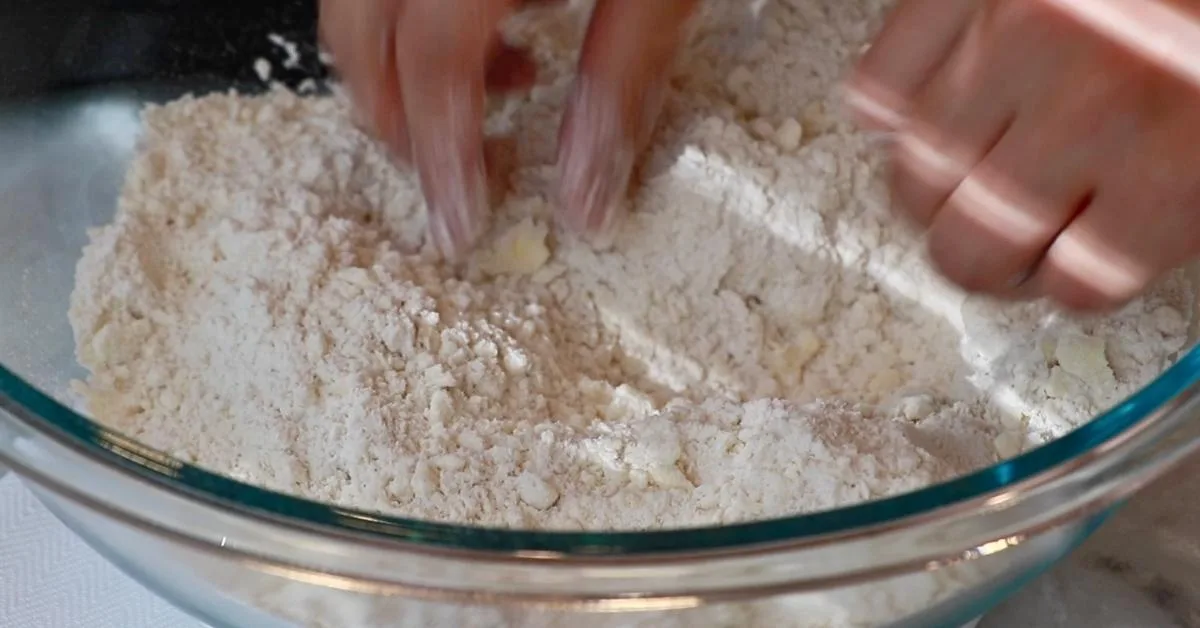 butter, flour, salt and sugar in a bowl to make pie dough