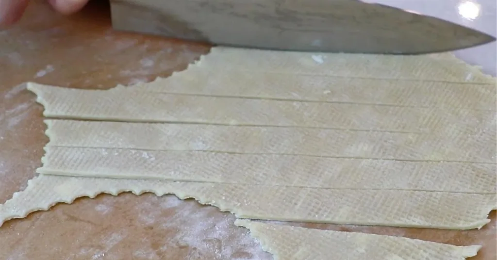 cutting pie dough into stripes
