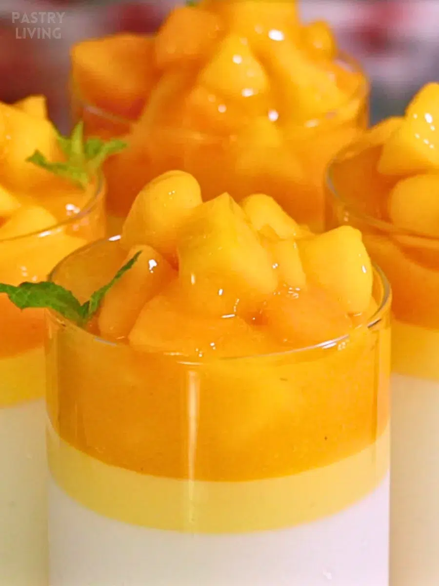 layers of vanilla and mango panna cotta with melty mango topping