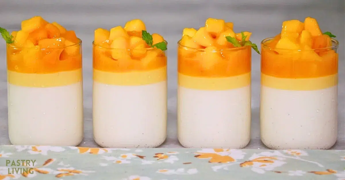 Smooth vanilla and mango panna cotta with melty mango topping in glasses