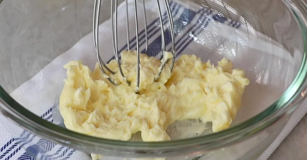 mixing unsalted butter in a bowl