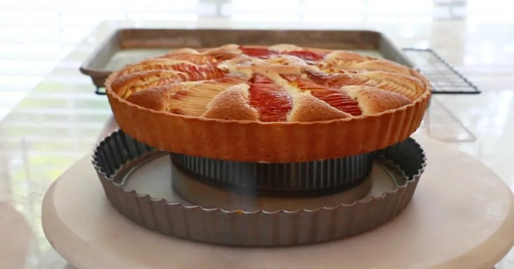 removing a pan from peach tart