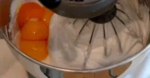 adding yolks to meringue