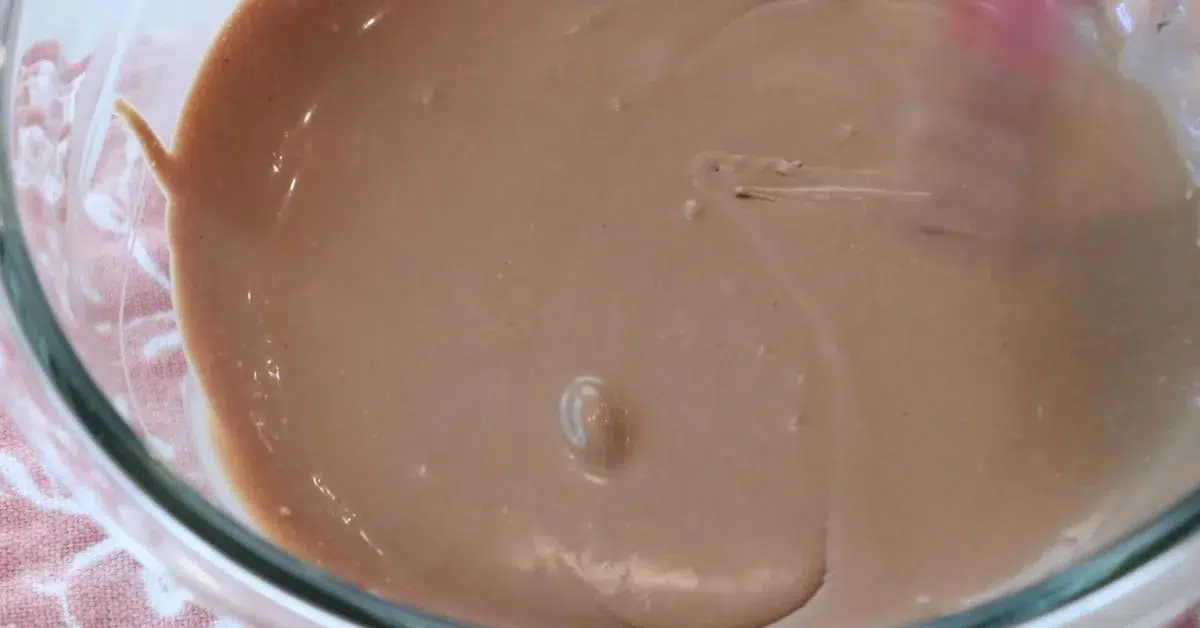 mixed melted dark chocolate, sugar, and heavy cream in a bowl to make chocolate mousse