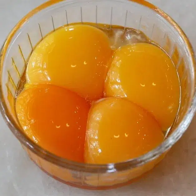 4 yolks in a cup