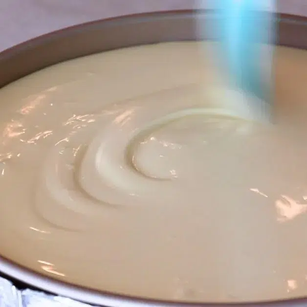 poured cheesecake batter into a pan