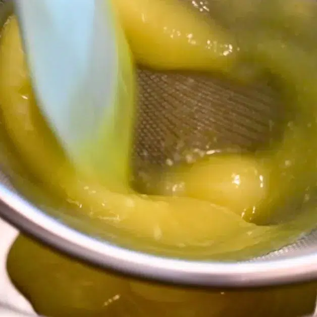 straining lemon curd