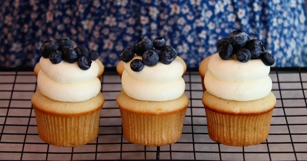 lemon cupcakes with lemon buttercream and fresh blueberries on top