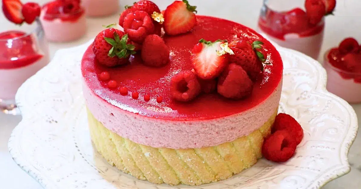 raspberry mousse cake on a white plate
