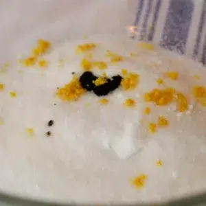 sugar, salt, vanilla beans, and lemon zest in a bowl