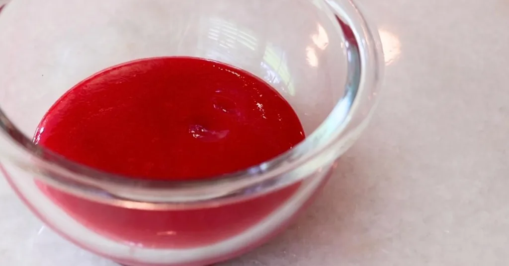 raspberry puree in a small glass bowl