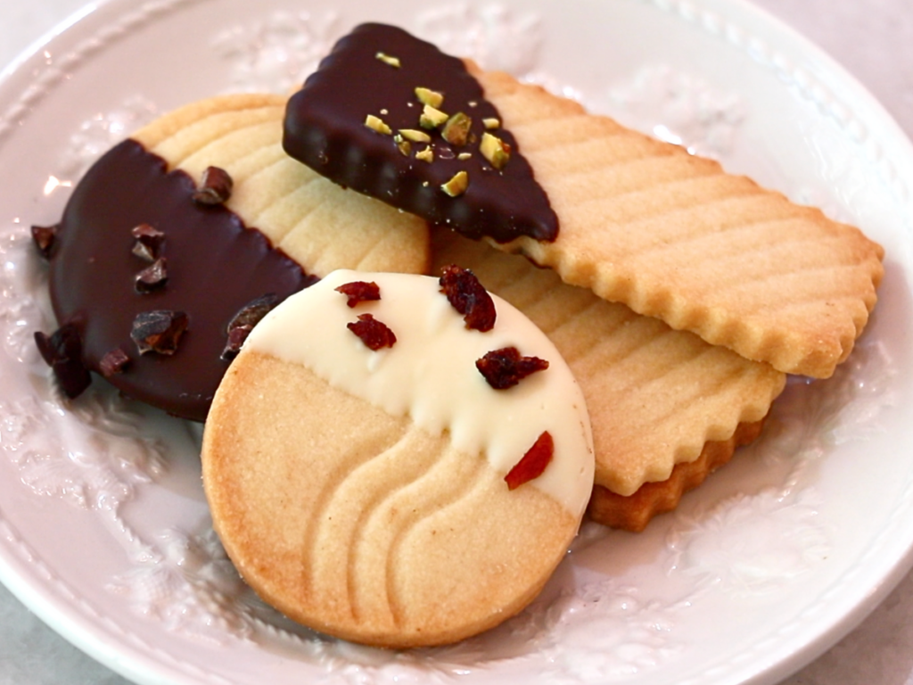 shortbread cookies coated with chocolate on a plate