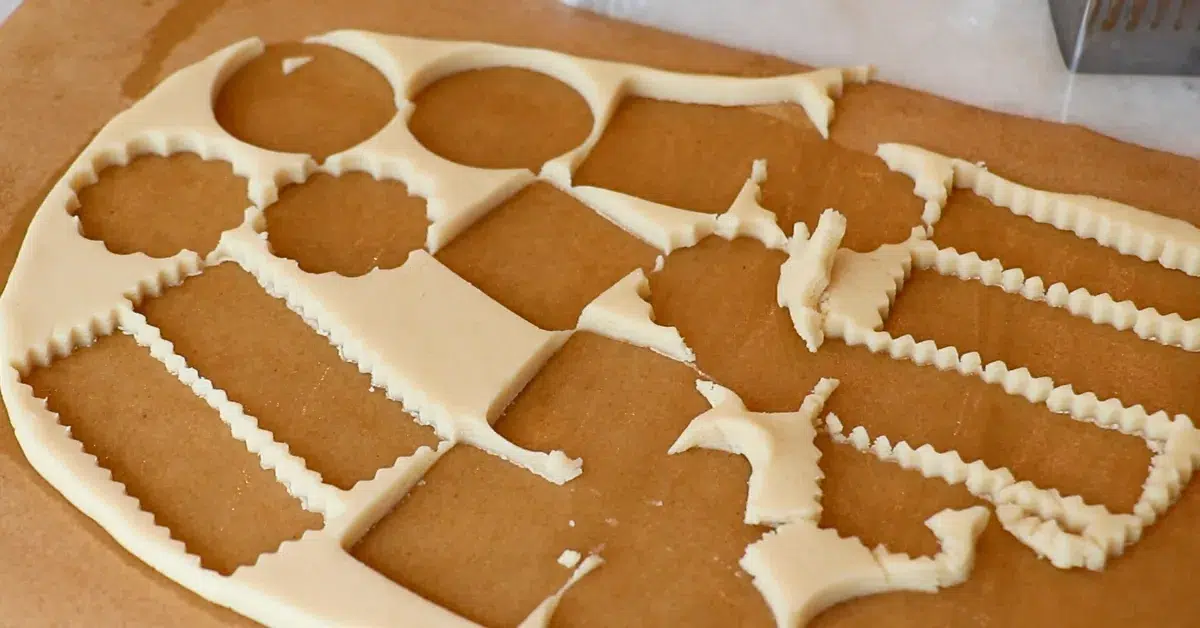 cut cookie dough with a cookie cutter