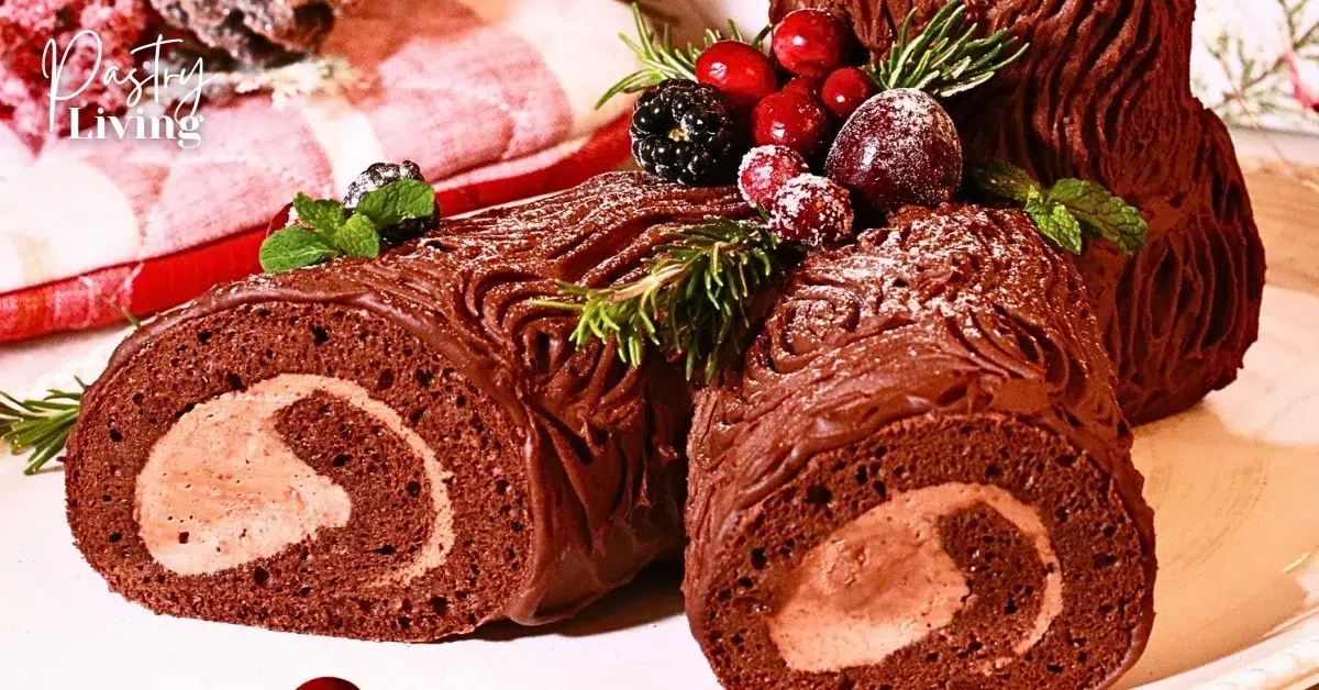homemade buche de noel decorated with herbs and fresh fruits