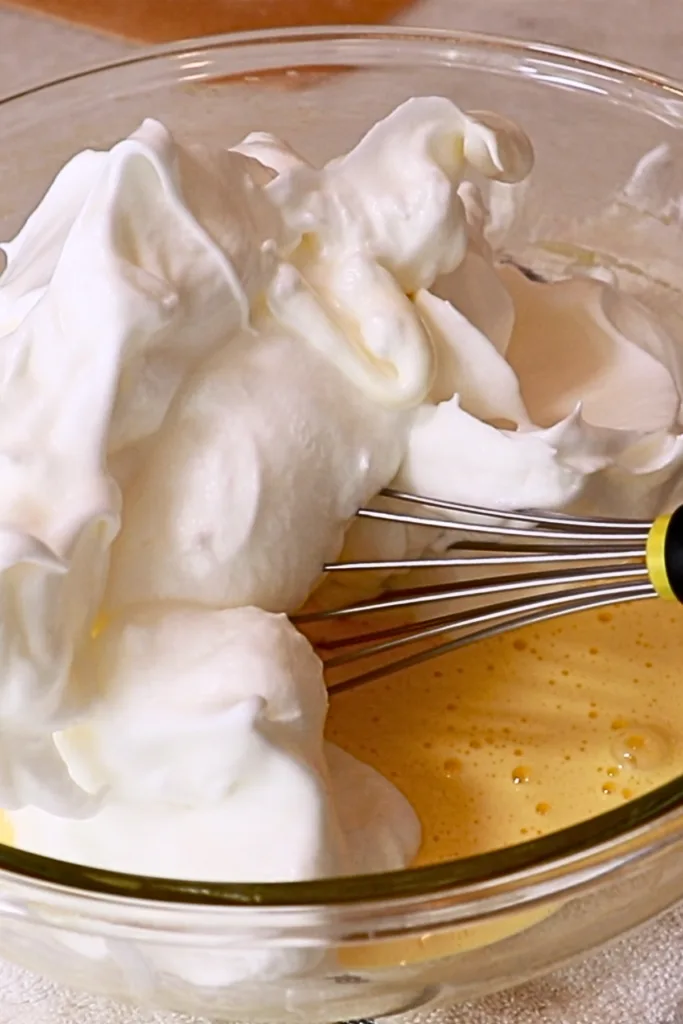 meringue and whipped yolks in a bowl