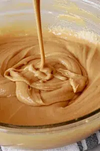 the cake batter in a bowl for peanut butter muffins