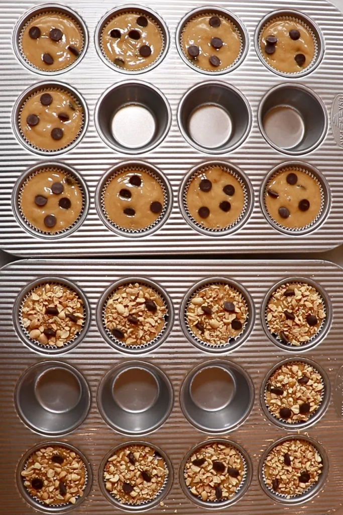 peanut butter muffin cake batter in cupcake pans before baking them
