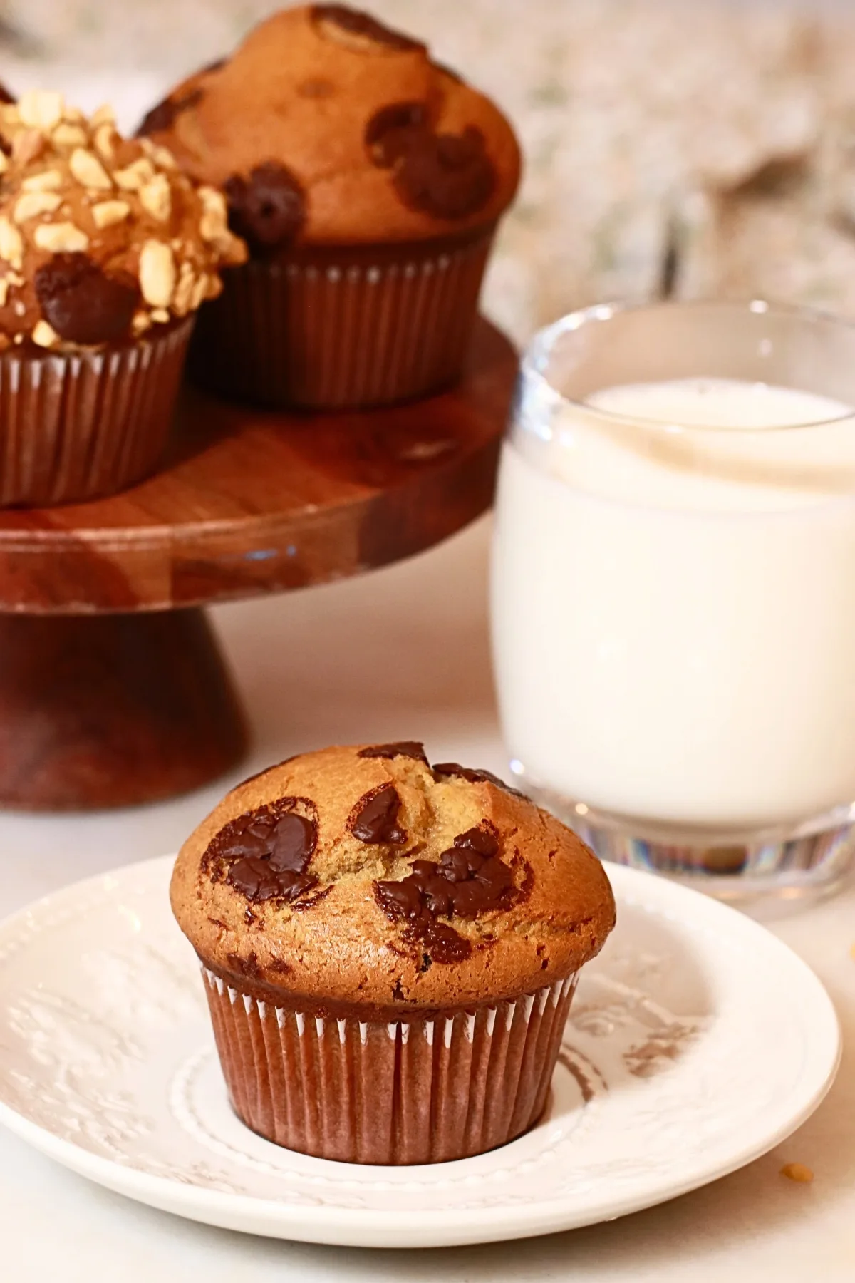 a homemade chocolate chip peanut butter muffin on a white plate